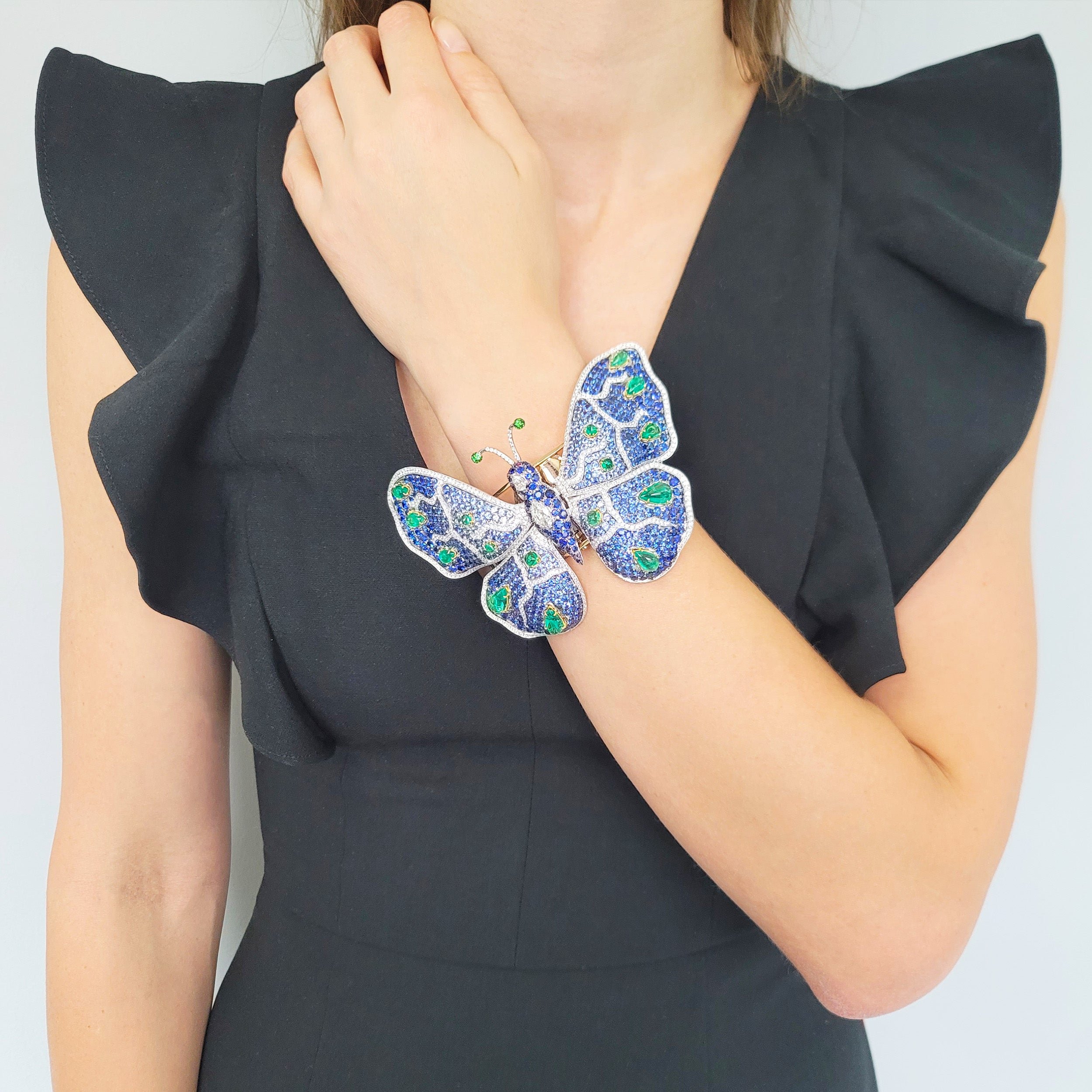 De Grisogono diamond and gemstone butterfly bangle in 18k yellow gold.