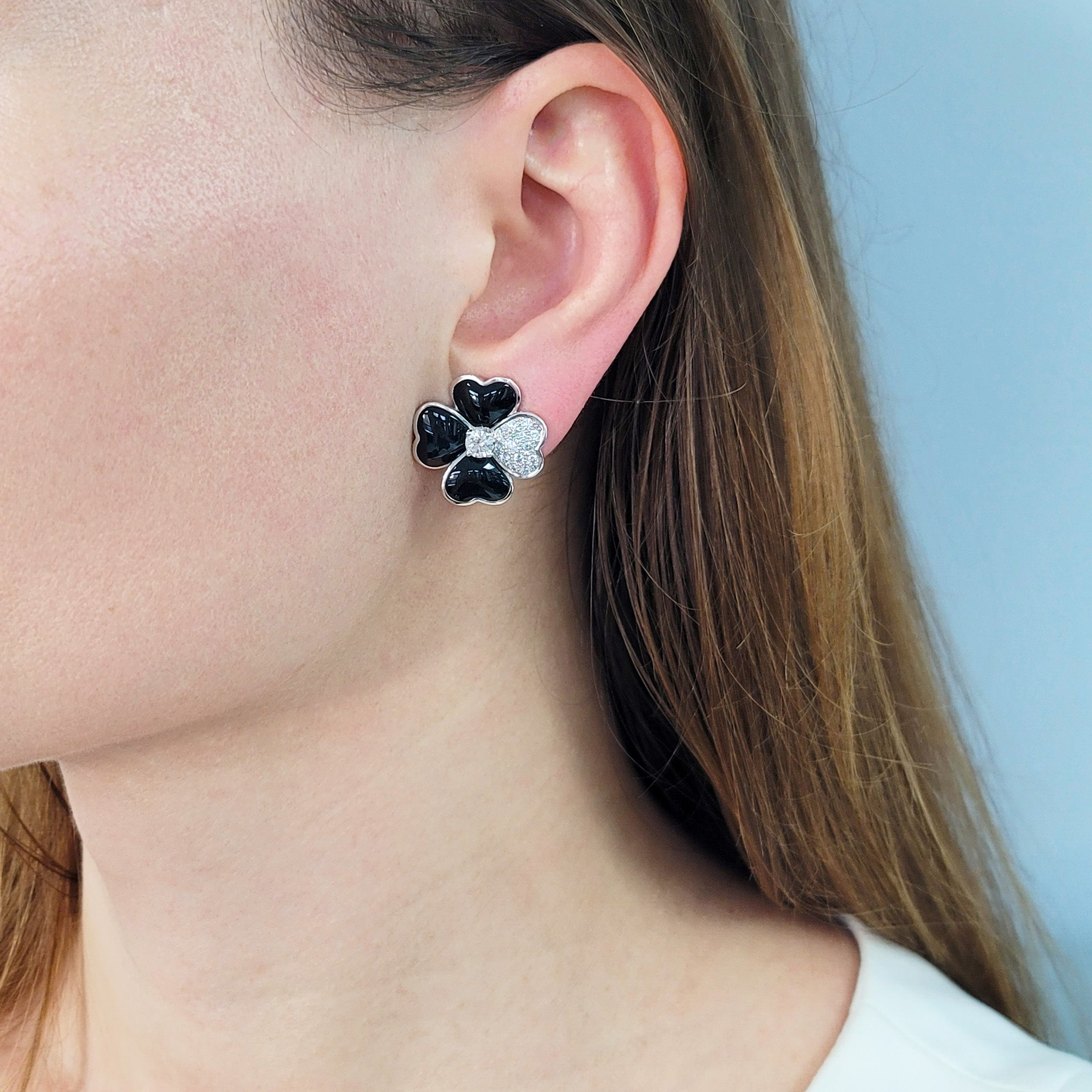 Van Cleef & Arpels Diamond, Onyx, and White Gold 'Cosmos' Clip Earrings