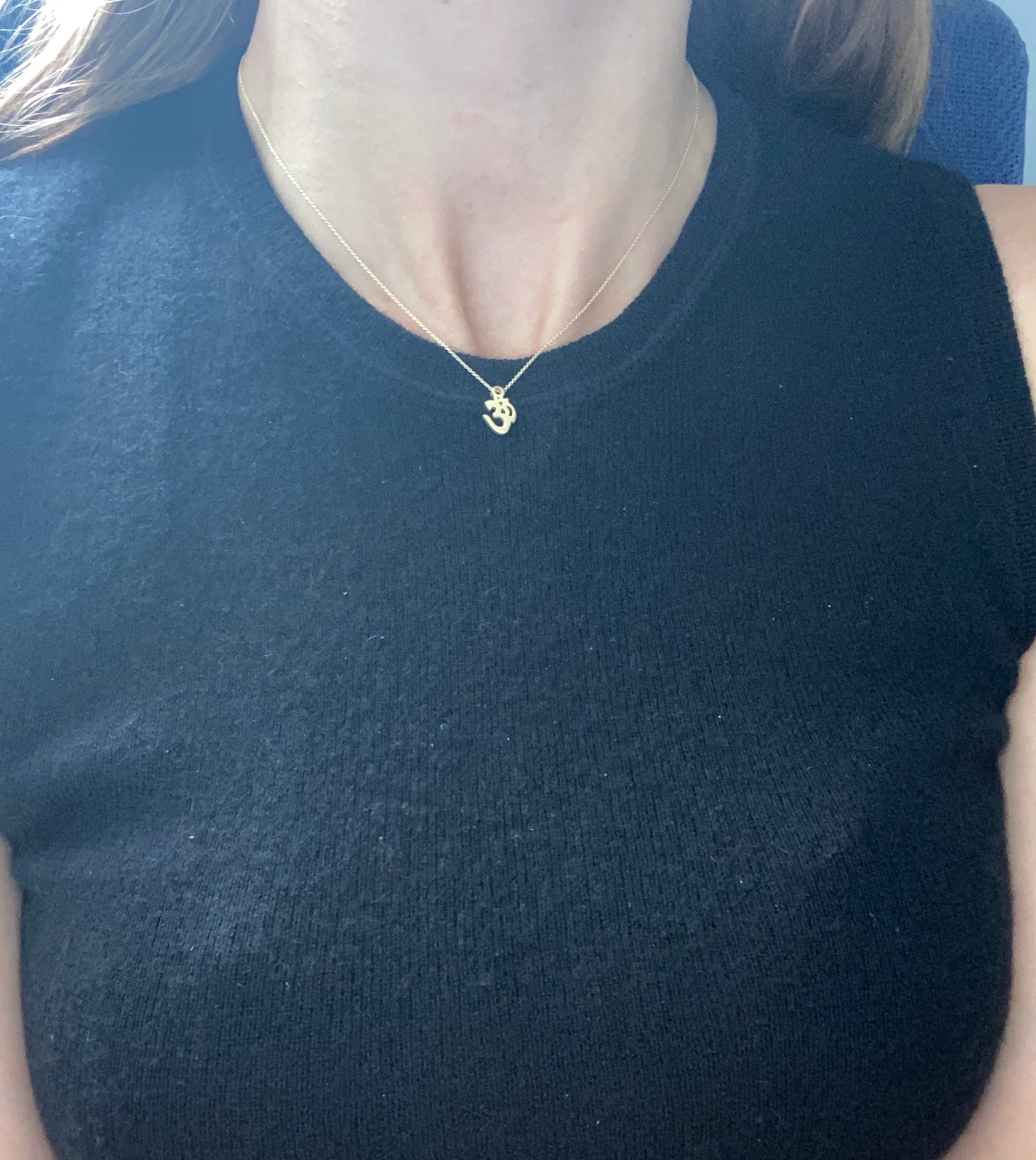 "OM" symbol pendant in 14k yellow gold