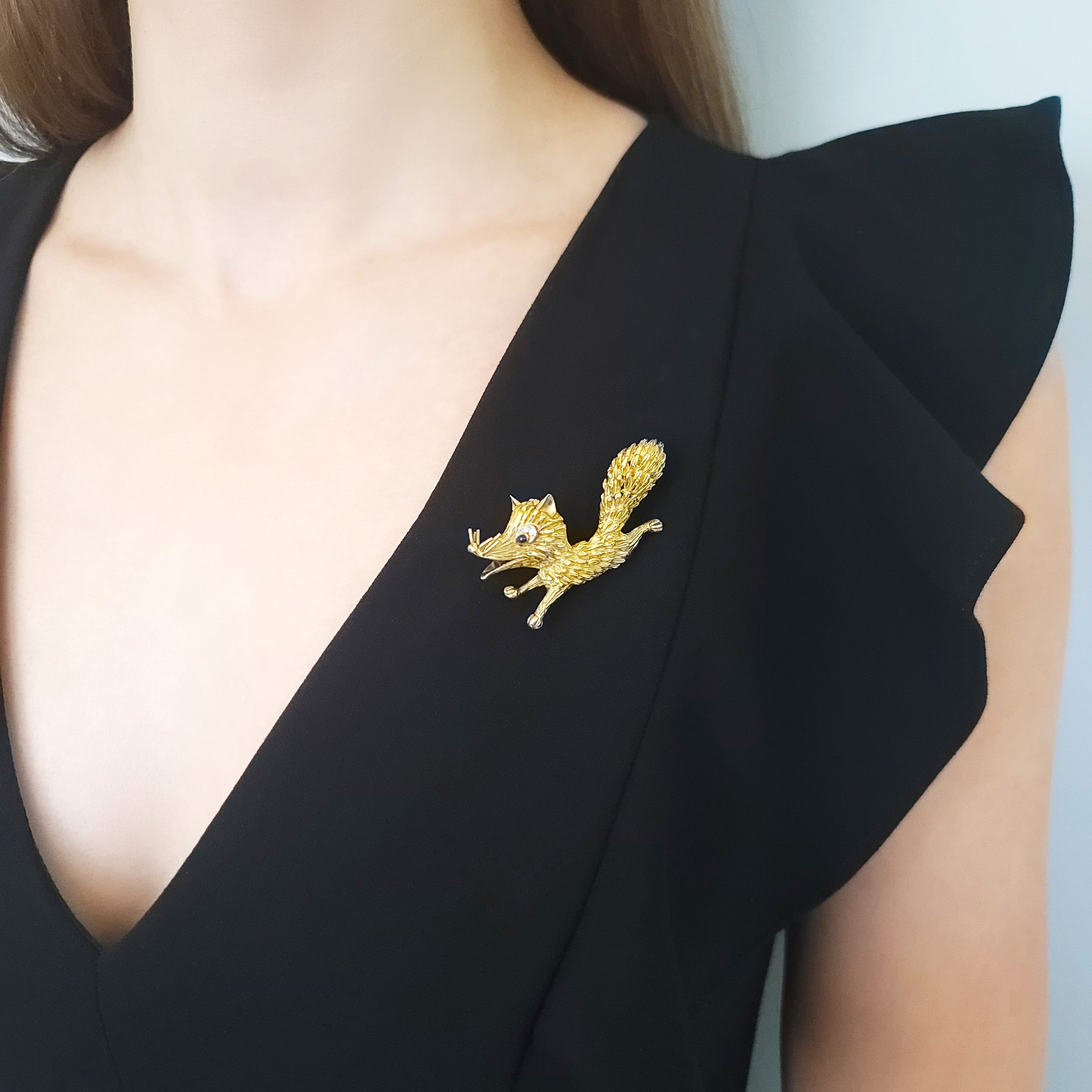 18k Yellow Gold Fox Brooch with Diamond and Sapphire Accents.