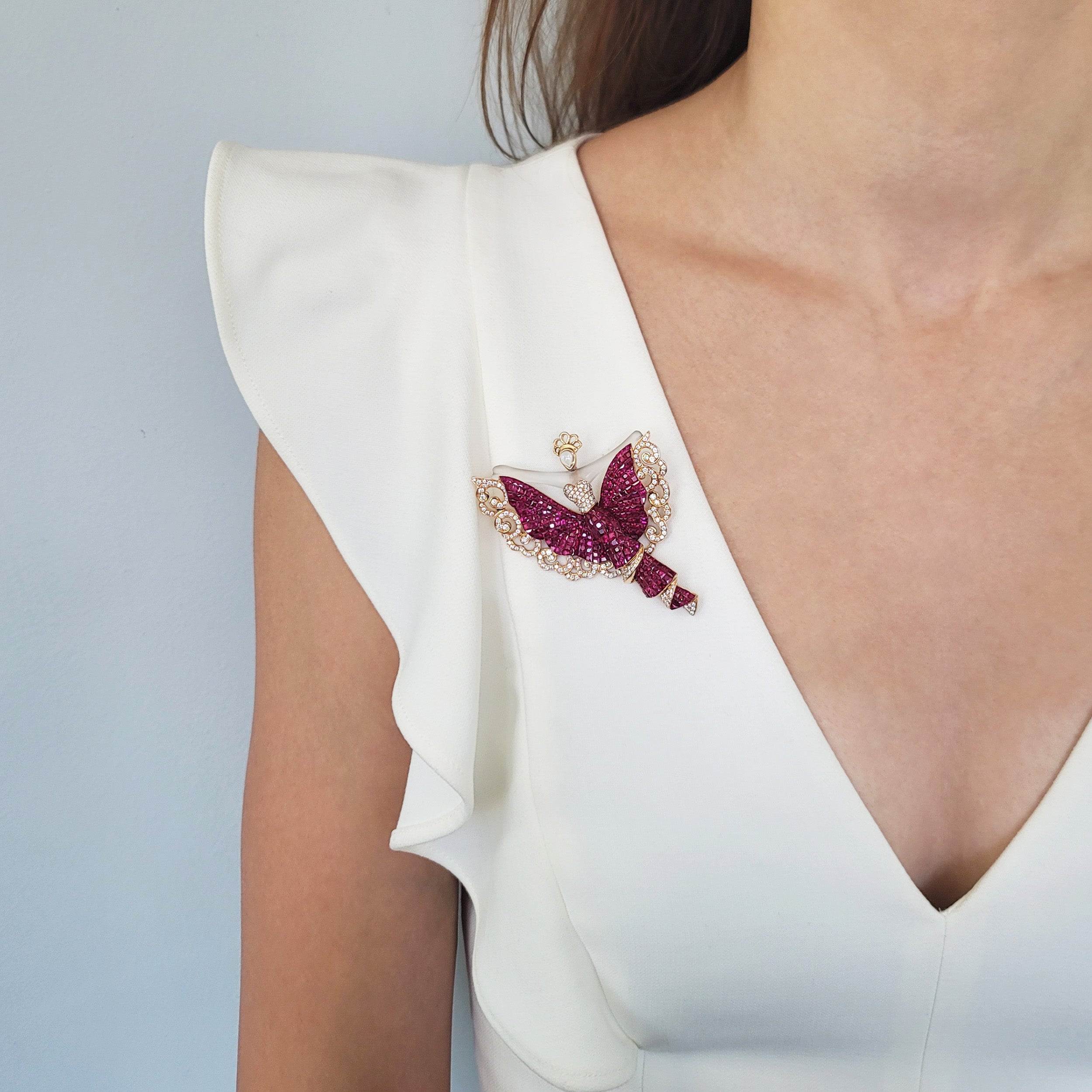 Invisibly set ruby, diamond and crystal brooch in 18k yellow gold.
