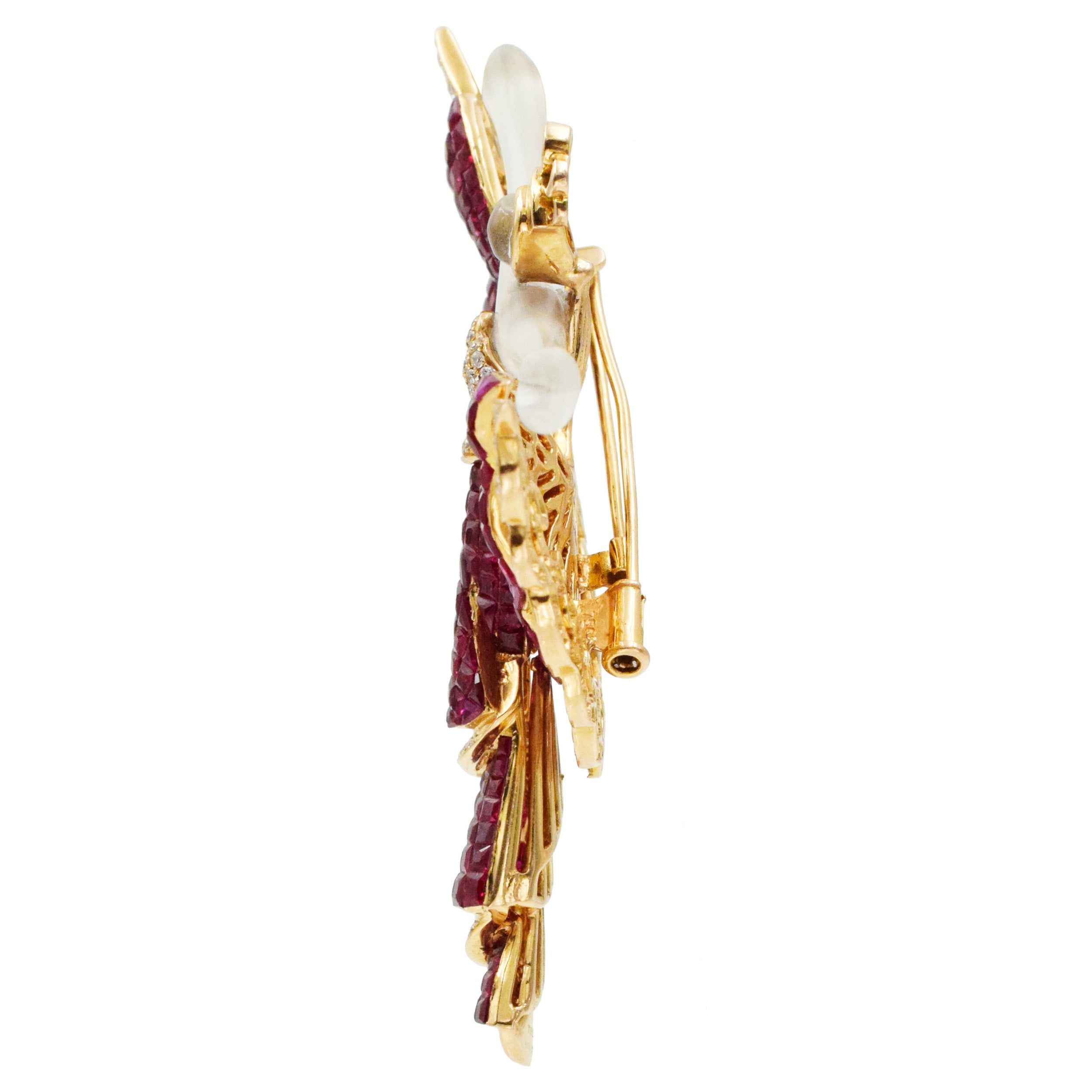 Invisibly set ruby, diamond and crystal brooch in 18k yellow gold.