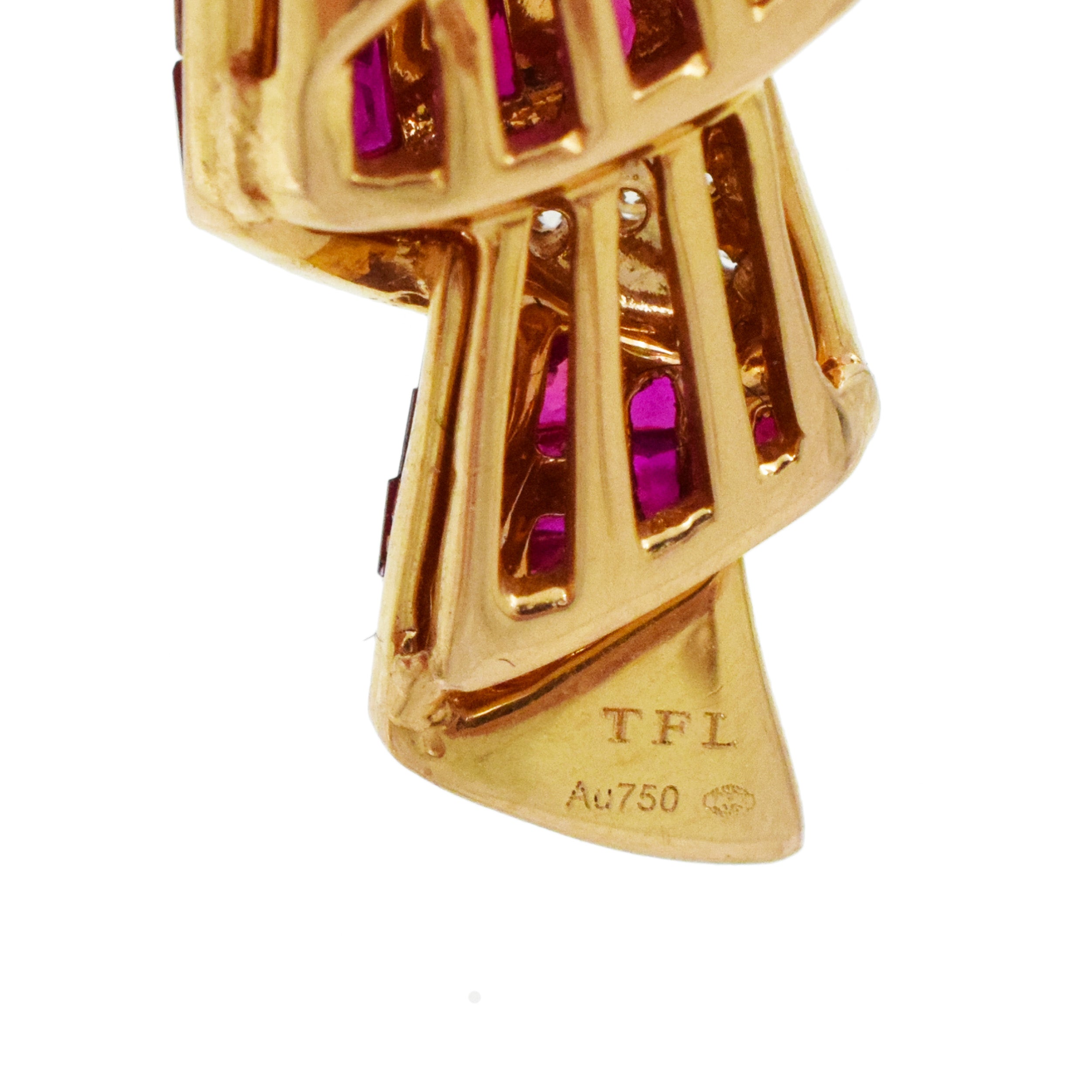 Invisibly set ruby, diamond and crystal brooch in 18k yellow gold.