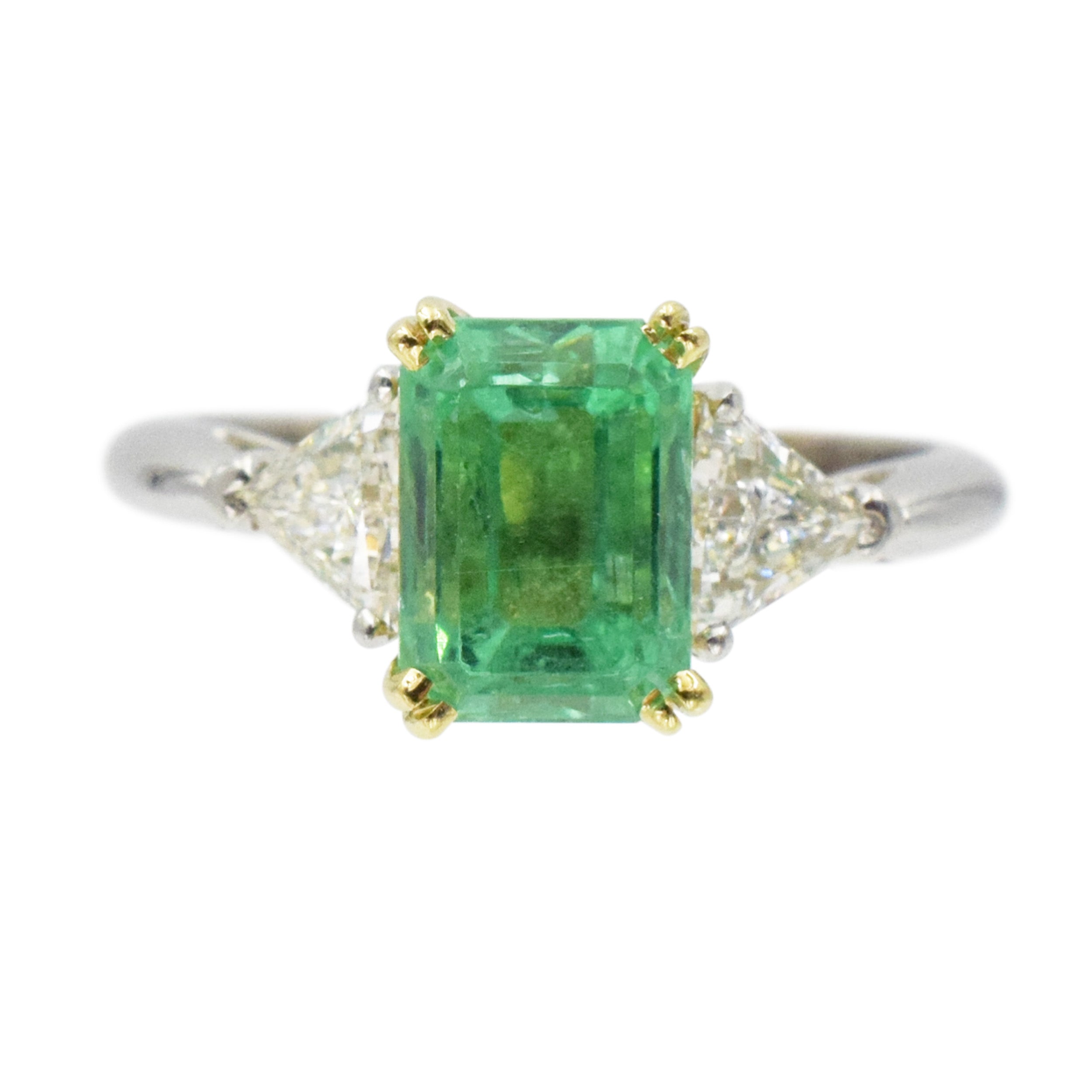 Emerald and diamond ring in platinum and 18k yellow gold.