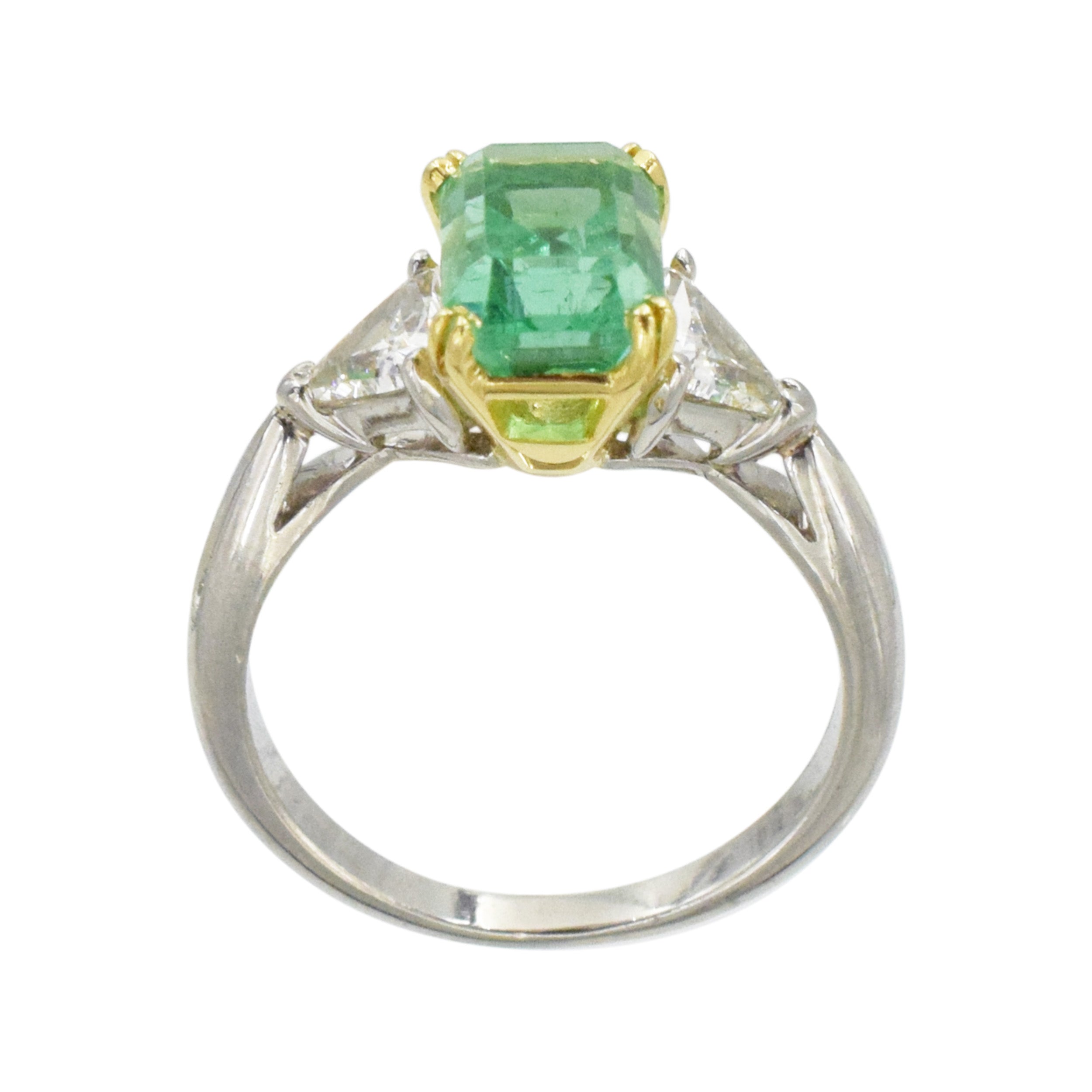 Emerald and diamond ring in platinum and 18k yellow gold.