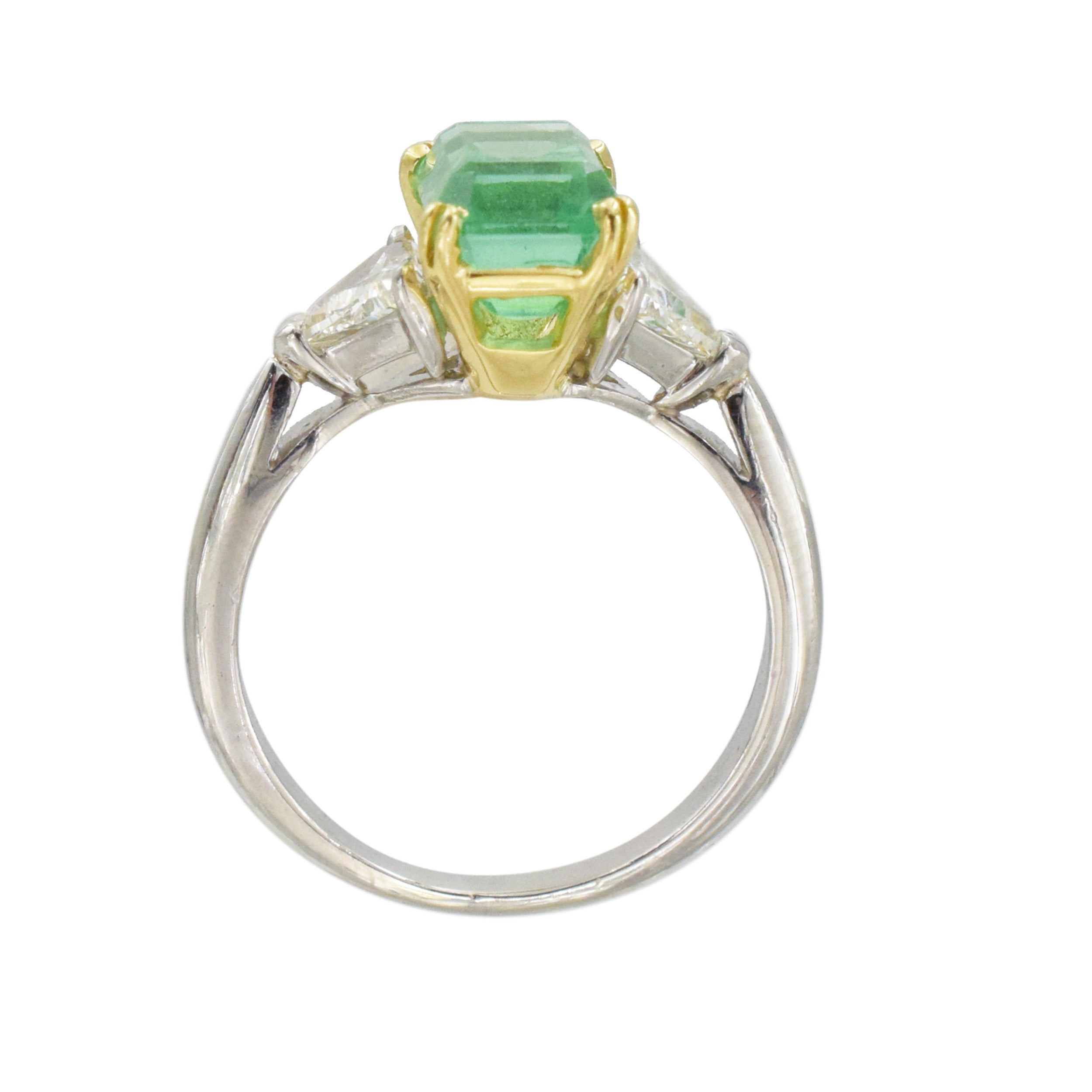 Emerald and diamond ring in platinum and 18k yellow gold.