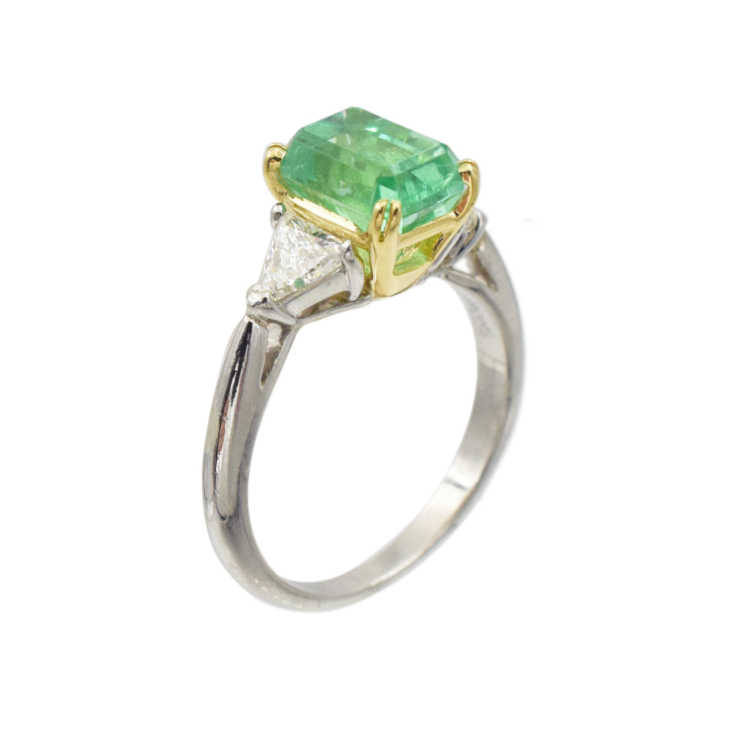 Emerald and diamond ring in platinum and 18k yellow gold.