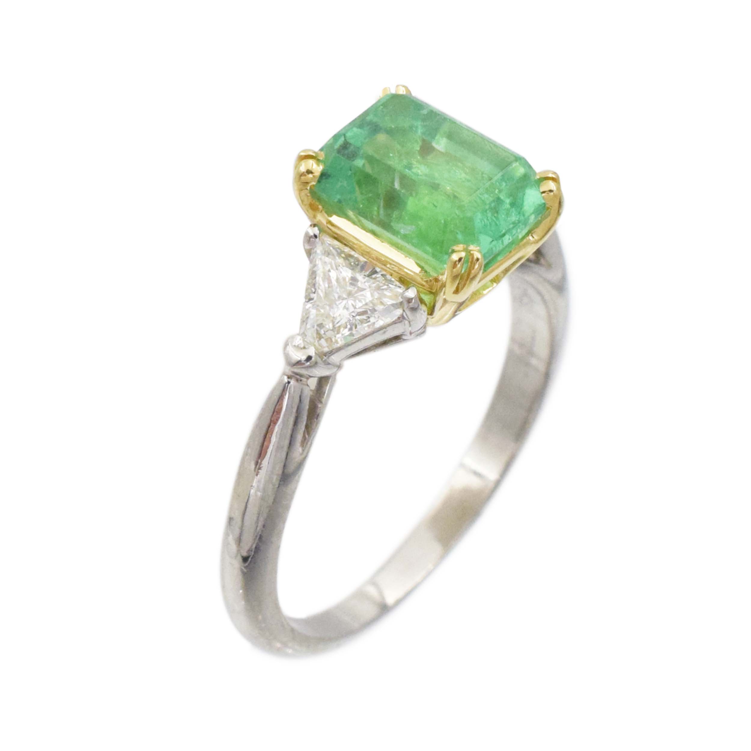 Emerald and diamond ring in platinum and 18k yellow gold.