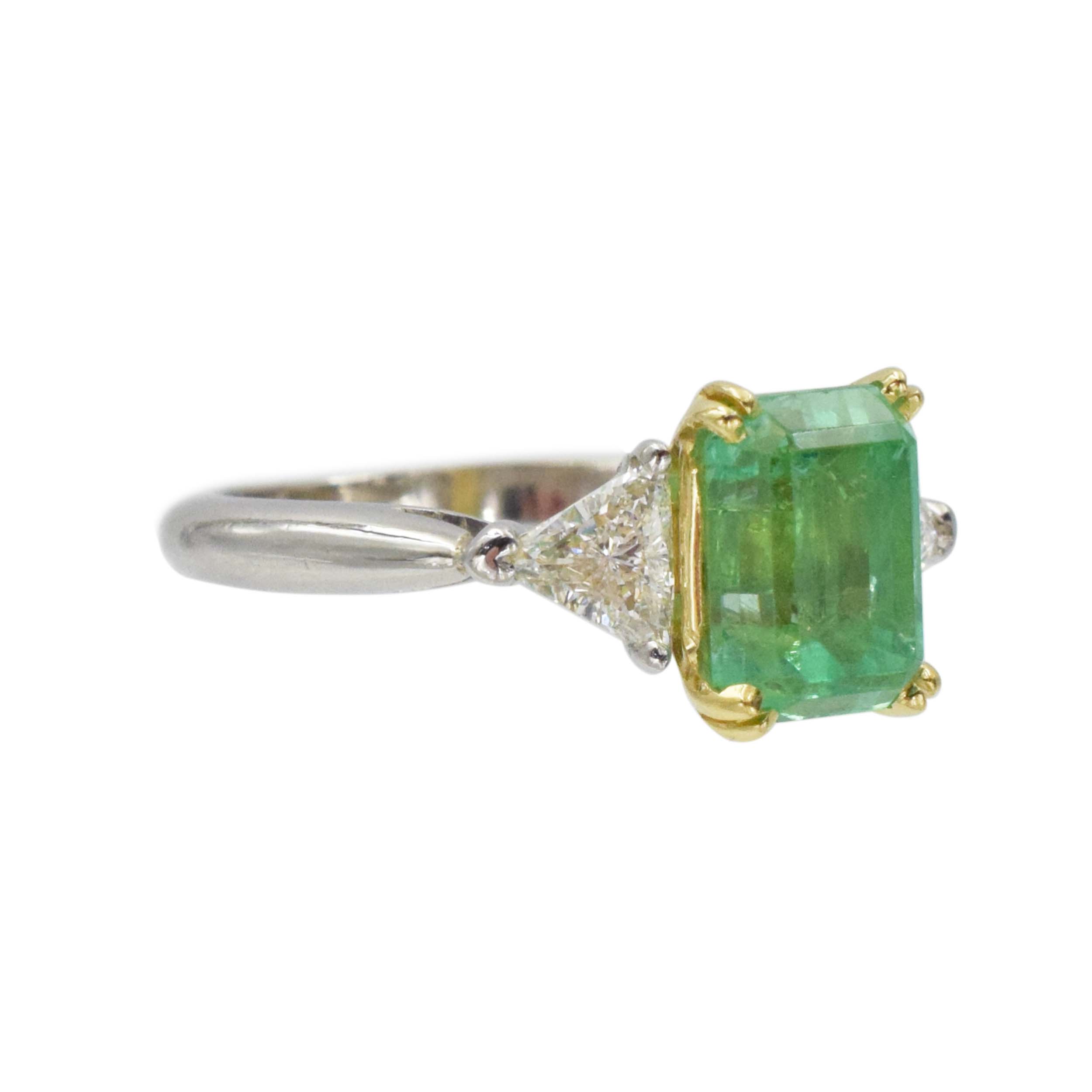 Emerald and diamond ring in platinum and 18k yellow gold.