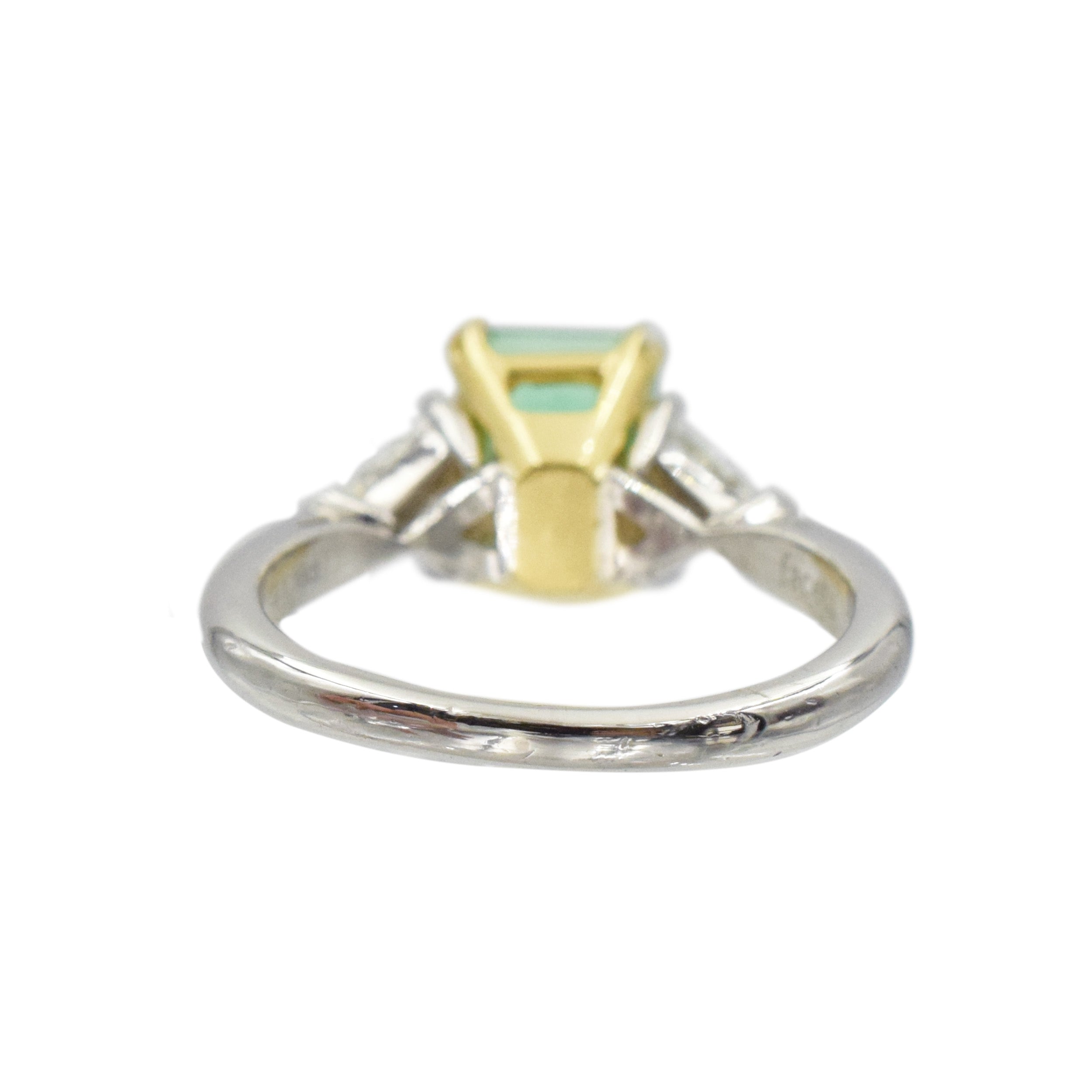 Emerald and diamond ring in platinum and 18k yellow gold.