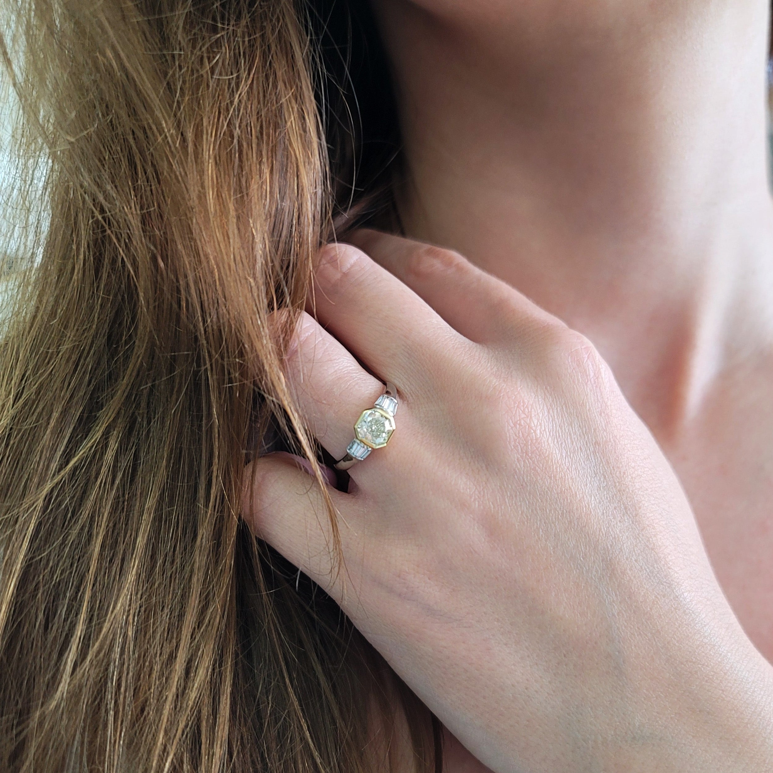 1.04ct color diamond and 0.20ct white diamond ring in platinum and 18k yellow gold. 