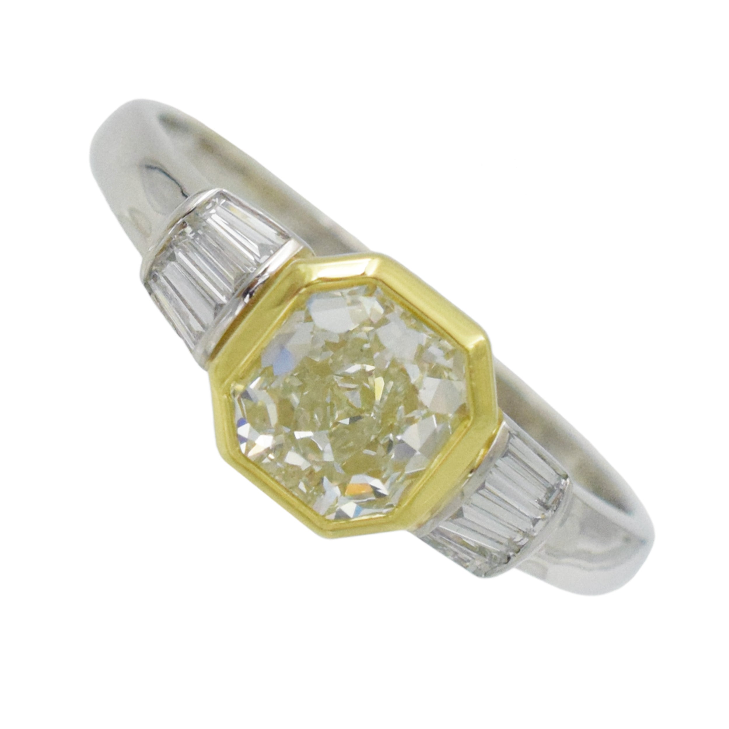 1.04ct color diamond and 0.20ct white diamond ring in platinum and 18k yellow gold. 