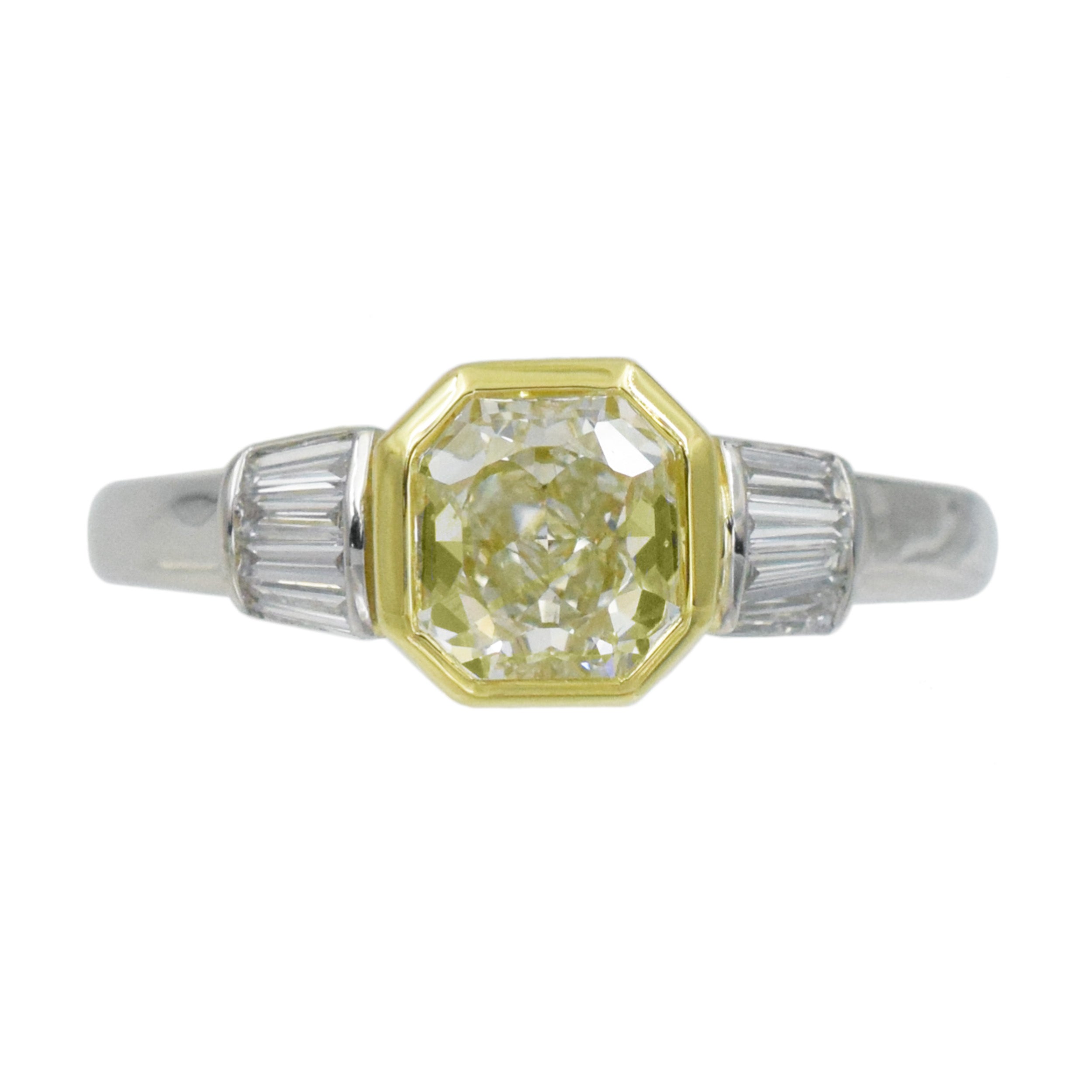 1.04ct color diamond and 0.20ct white diamond ring in platinum and 18k yellow gold. 