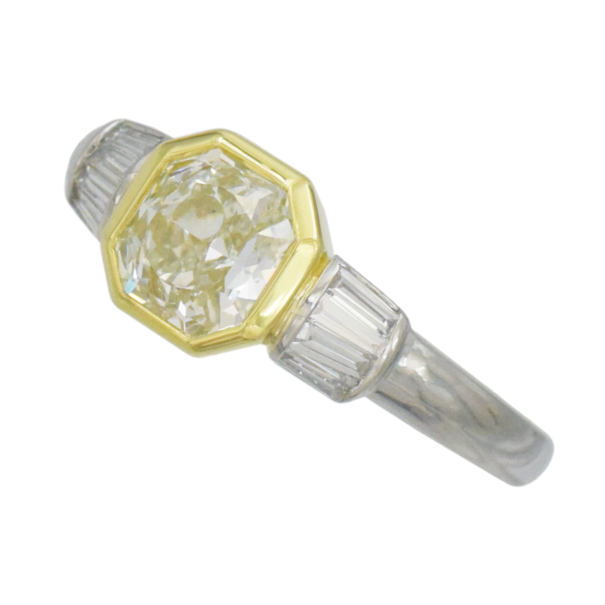 1.04ct color diamond and 0.20ct white diamond ring in platinum and 18k yellow gold. 