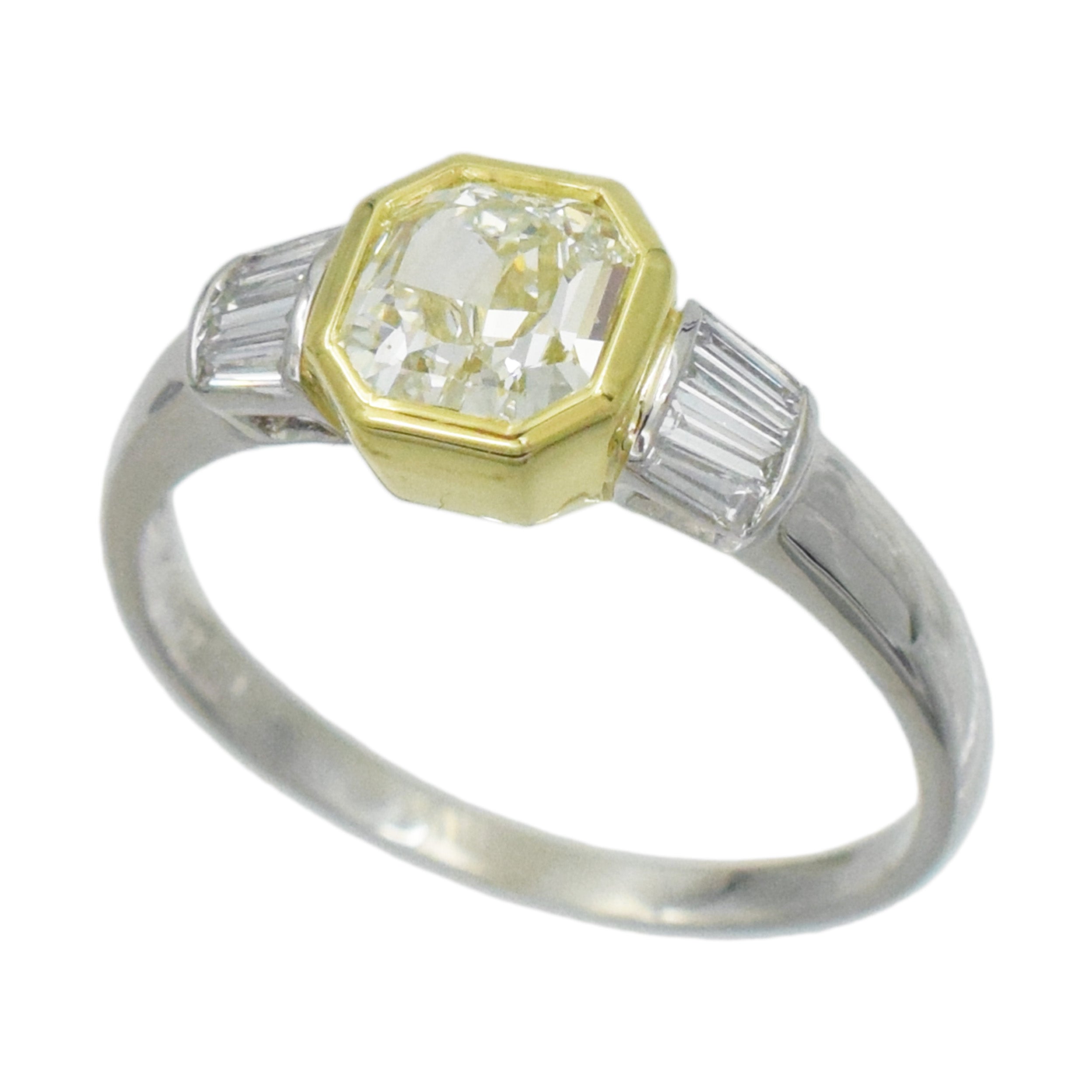 1.04ct color diamond and 0.20ct white diamond ring in platinum and 18k yellow gold. 