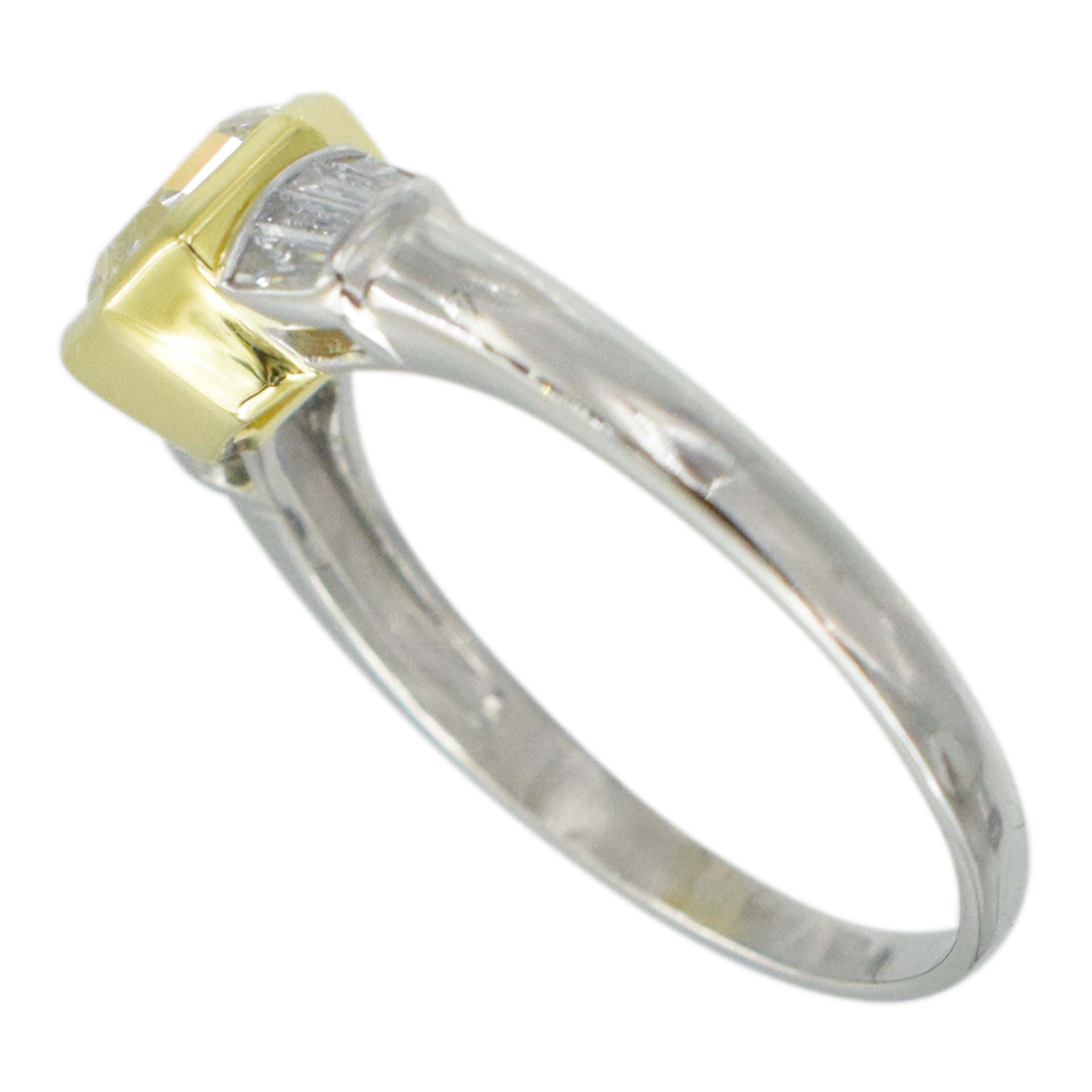 1.04ct color diamond and 0.20ct white diamond ring in platinum and 18k yellow gold. 