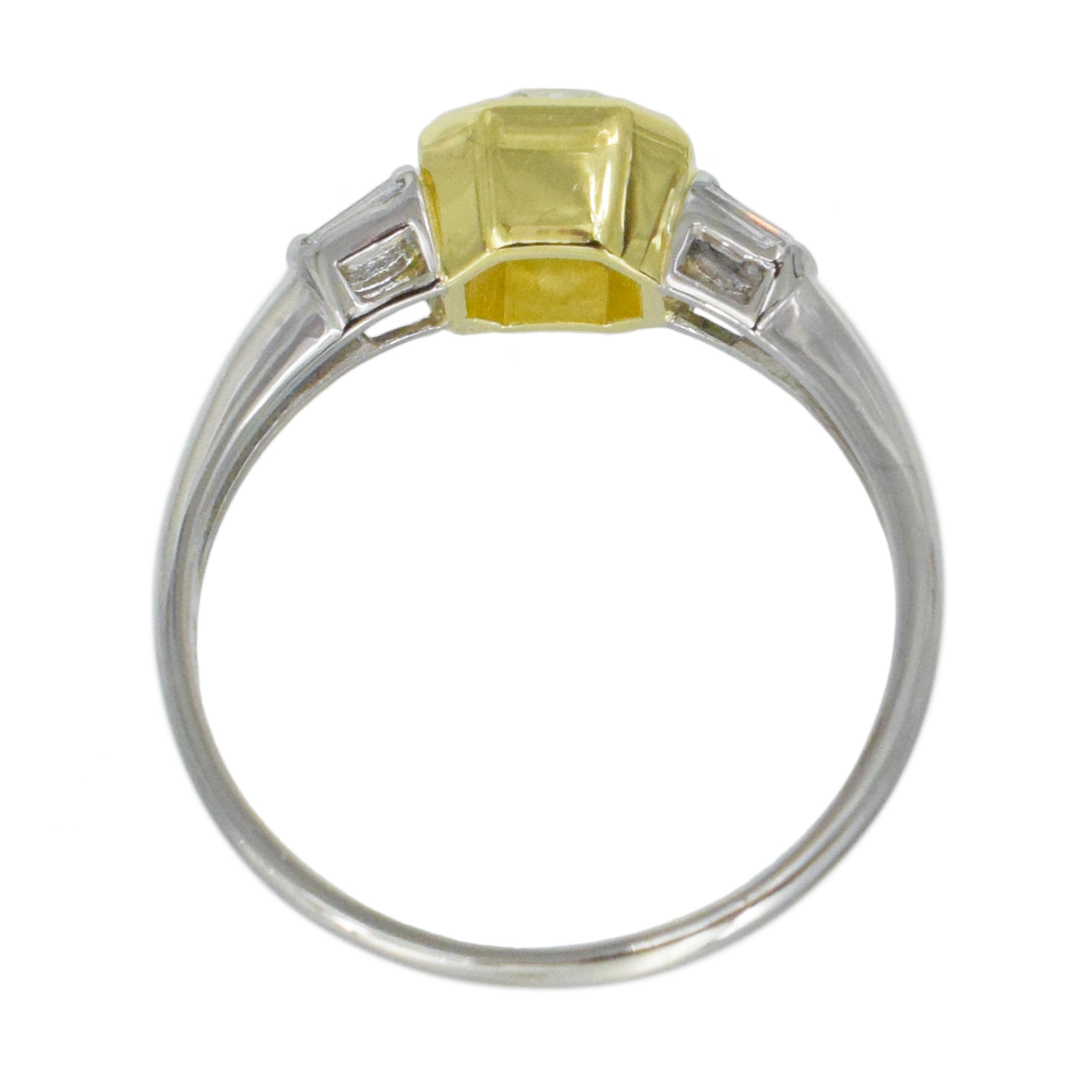1.04ct color diamond and 0.20ct white diamond ring in platinum and 18k yellow gold. 