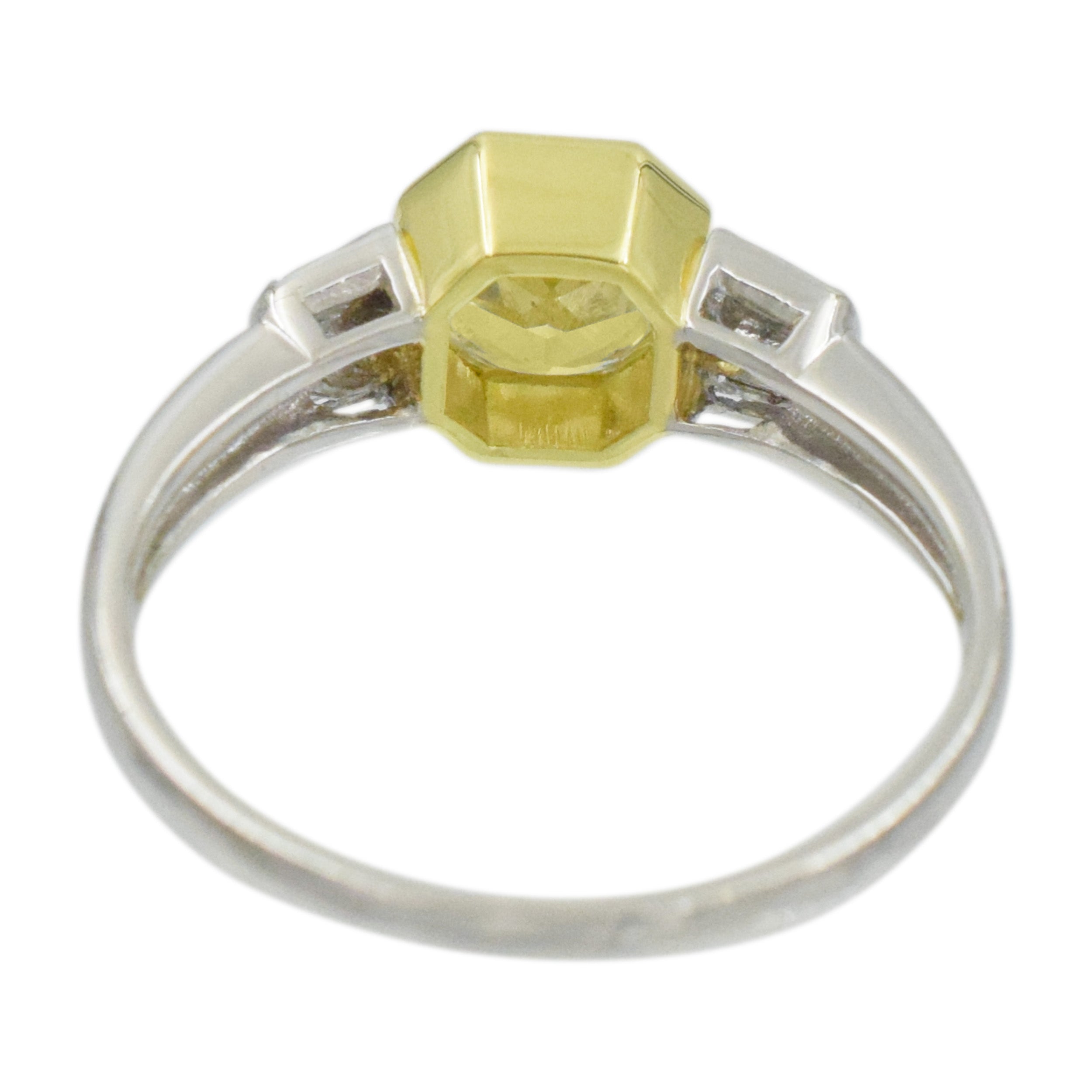 1.04ct color diamond and 0.20ct white diamond ring in platinum and 18k yellow gold. 