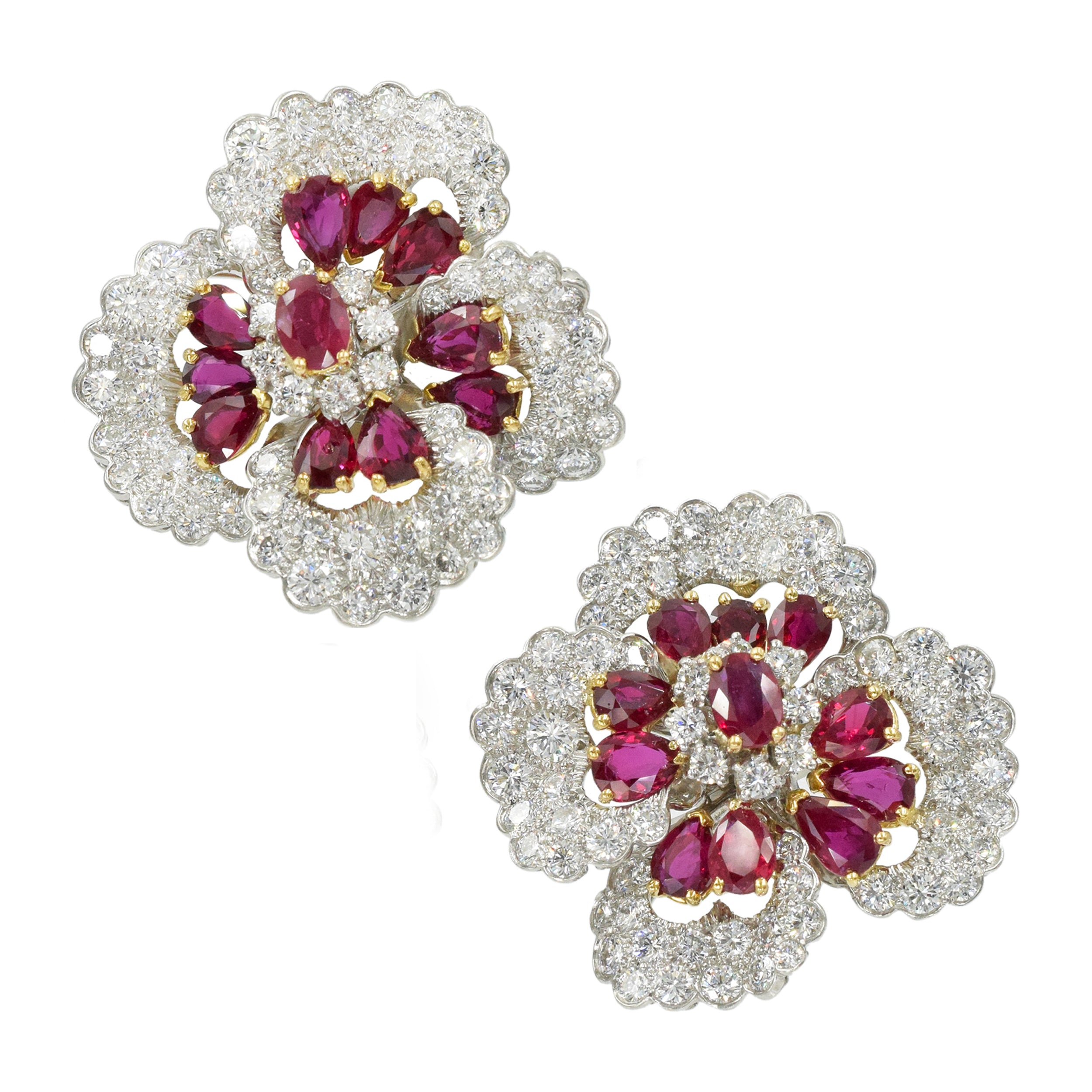 Stunning ruby and diamond earrings by Oscar Heyman, crafted in platinum and 18k yellow gold, designed as large flower blossoms encrusted with 144 round brilliant cut diamonds and accented with 22 oval shaped rubies, secured with omega fastening. Diamonds total weight approx. 16.5ct. Color range from E fo F Clarity range VS+ Rubies total weight approx. 7.5ct. Measurements 36mm by 37mm Weight 49g. Stamped Plat, 18k and numbered Ref# 810-000-1987