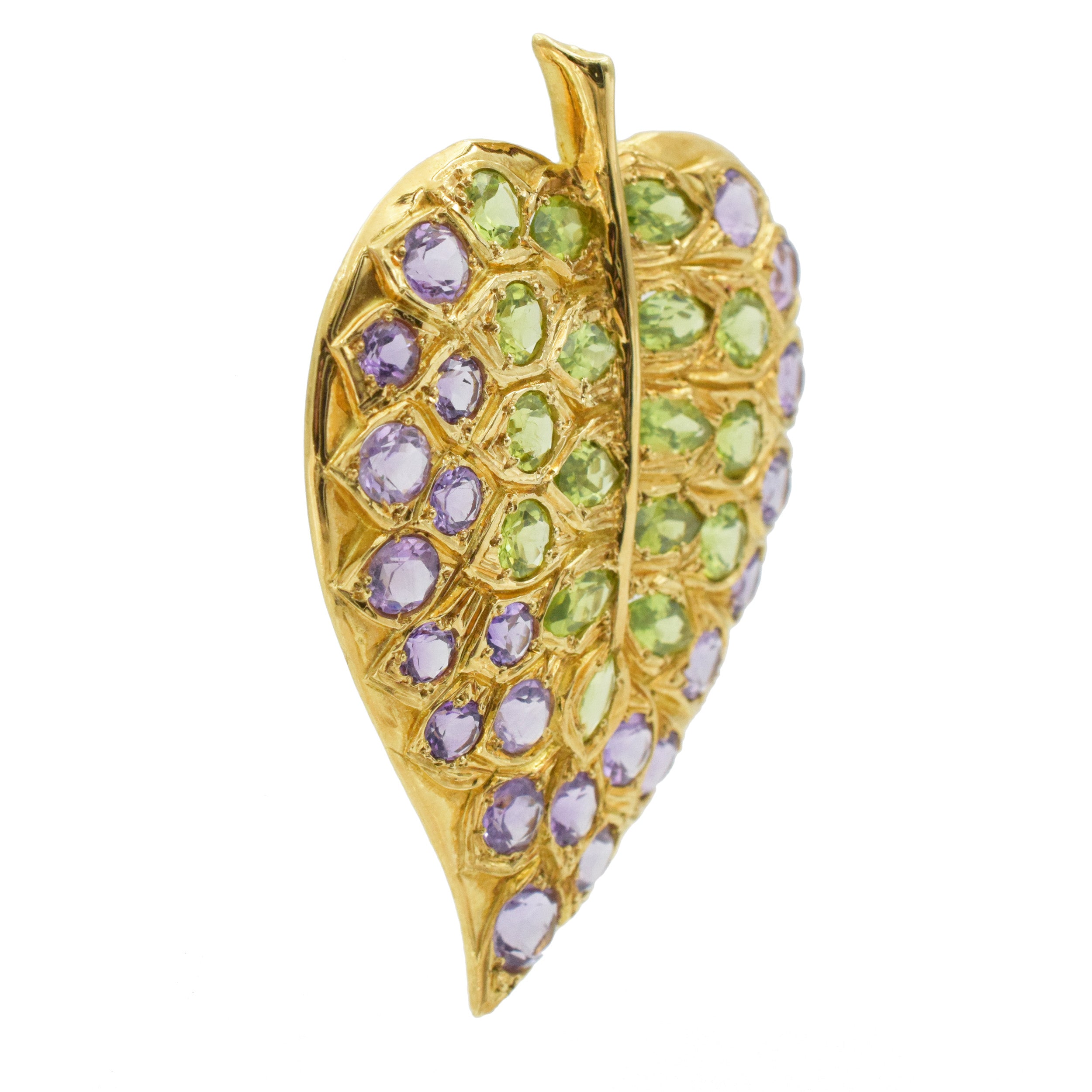 Pair of amethyst and peridot leaf brooches in 18k yellow gold.