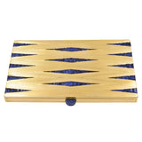 Retro sapphire box, crafted in beautifully textured 18k yellow gold and decorated with 144 channel set fancy shaped sapphires, and cabochon sapphire unlocking the box.  Sapphires total weight approx. 25ct.  Measurements 130mm by 77.8mm by 10.2mm Weight 261g.  Made in France It Is numbered 61736 and it has a maker's mark with the initials of R.L.  Circa 1940-1950  Ref# 950-000-2067